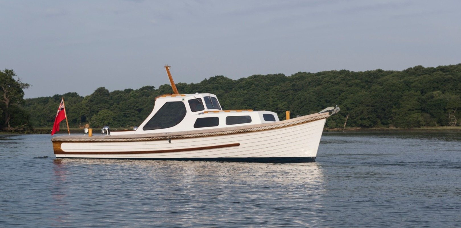 Private pleasure craft boat sailing on the water